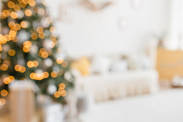 Beautiful holiday decorated room with Christmas tree and bright lights , out of focus shot for photo background. Blur christmas background