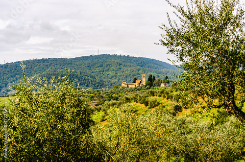 View of Ss. Mary and Leonard parsih church in Artimino with typical tuscan landscape
