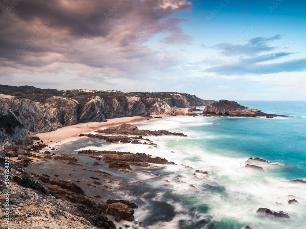 27/09-18, Zambujeira do Mar, Portugal. View over a beautiful sand beach. A storm is forming over land.