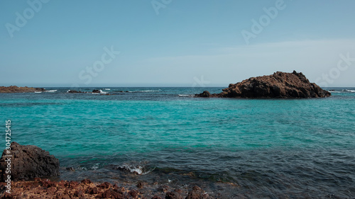 Fototapeta Naklejka Na Ścianę i Meble -  Pristine lagoons at the natural reserve of the island of Los Lobos, a small isle located north of the island of Fuerteventura, visited by a limited number of tourists daily, in Canary Islands, Spain