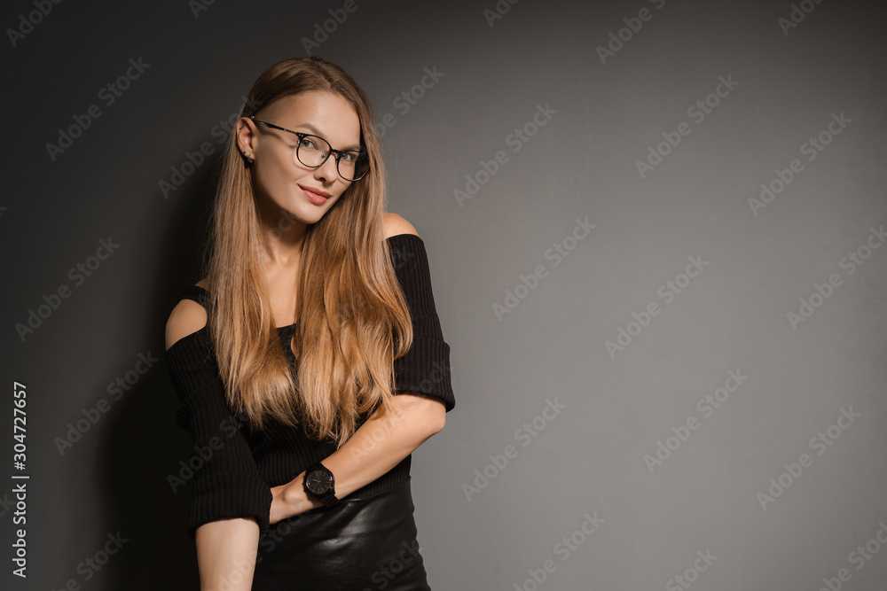 Elegant smiling woman in eyeglasses on black background Elegant smiling woman in eyeglasses on black background