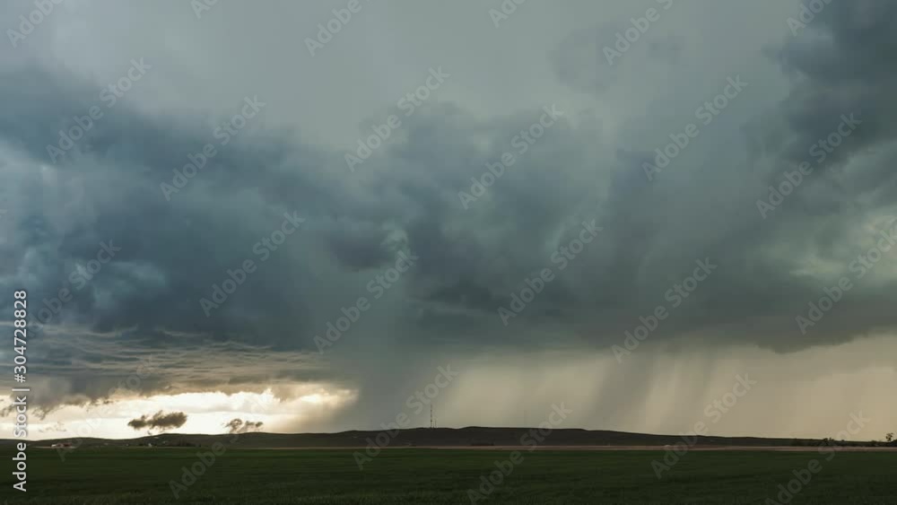 Rain storm moving over the landscape during tornado warning. Rain storm moving over the landscape during tornado warning.