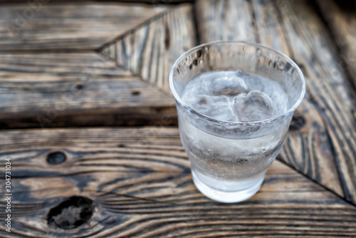 glass of water on wooden table