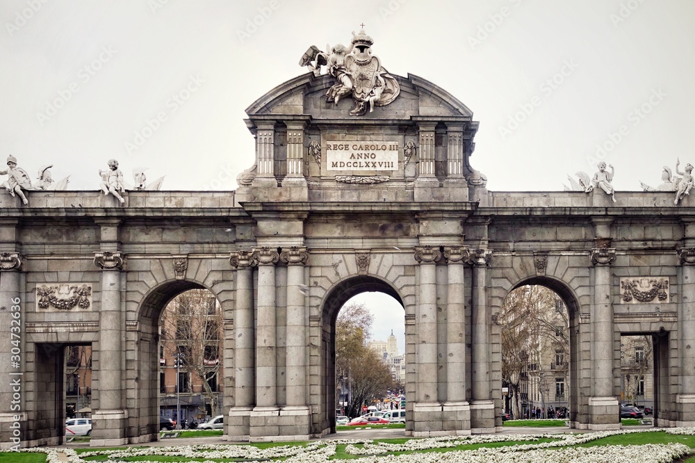 MADRID, SPAIN - MARCH 23, 2018: The Puerta de Alcala (Alcala Gate) on the Plaza de la Independencia (Independence Square) in Madrid, Spain 