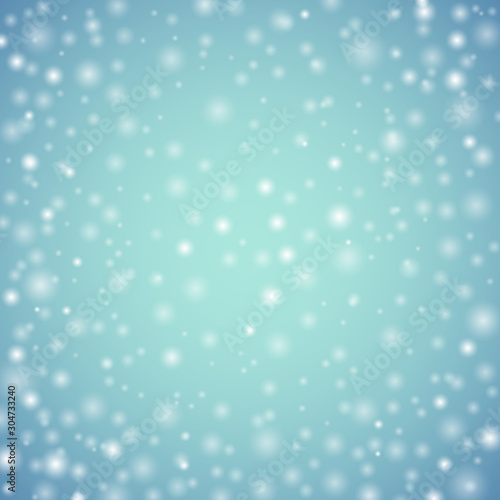 Light blurred bokeh winter background.Holiday snowfall illustration.