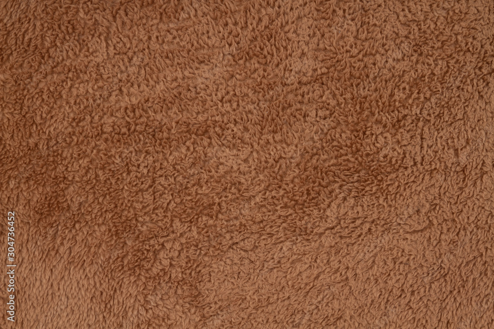 Brown sherpa textured plush fabric material background Stock Photo