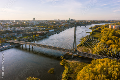 Drone landscape shot in the city of Warsaw, Poland.19. October. 2019. Aerial view of the Warsaw sky, river, bridge and roadway at sunrise on a foggy morning. 