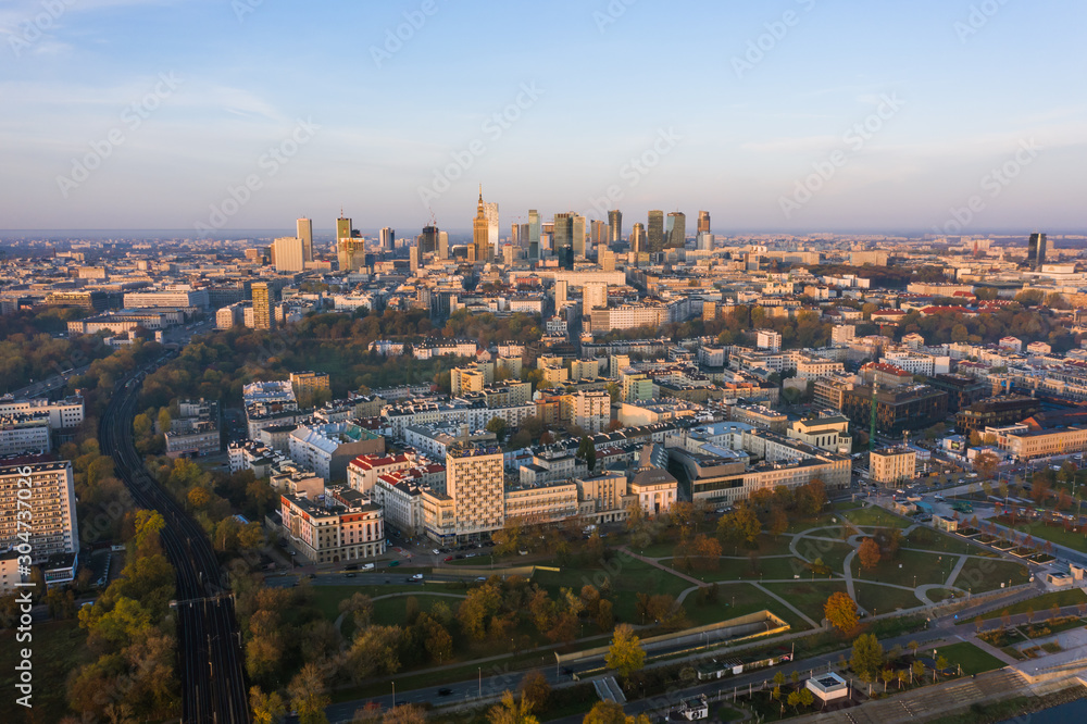 Warsaw, Poland. City landscape at sunrise. Aerial view of the river and the city with skyscrapers and buildings in the early morning.
