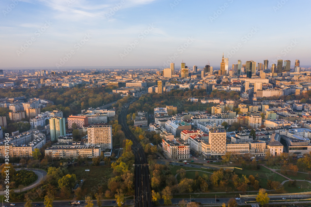 Warsaw, Poland. City landscape at sunrise. Aerial view of the river and the city with skyscrapers and buildings in the early morning.