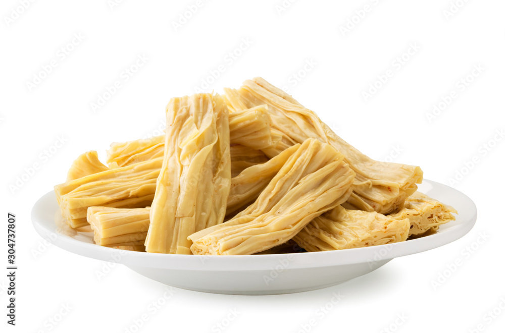 Korean asparagus in a plate close-up on a white. Isolated Korean asparagus in a plate close-up on a white. Isolated