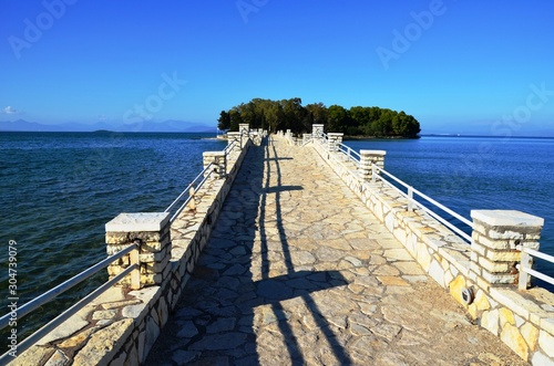 Vonitsa, Greece, 10/20/2019. concrete stone bridge to the Κοuκοumitsa island (Vonitsa island) in the Ionian Sea photo