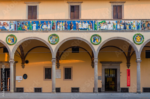 Pistoia old Ceppo hospital palace front facade with beautiful decoration and arches