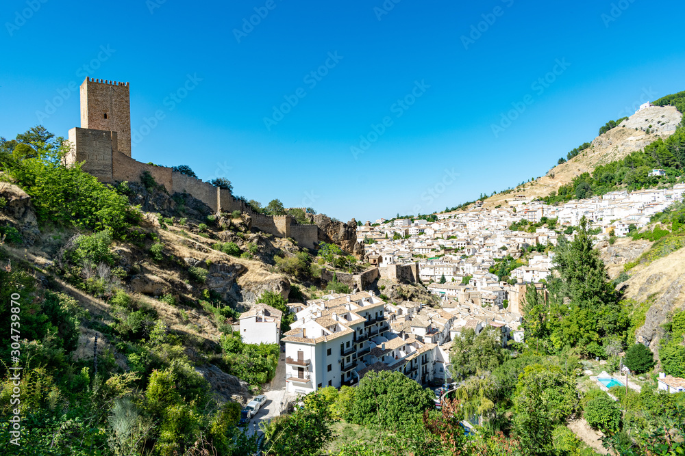 a view of the castle ruins and the small town of Cazorla, Spain