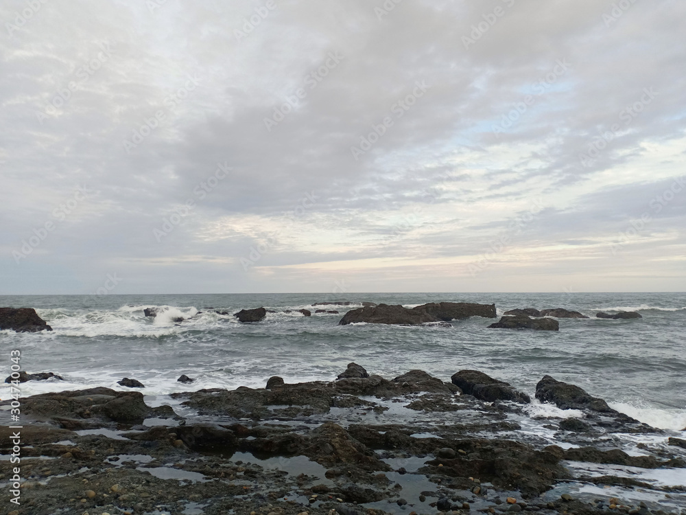 The view of the sea is rocky and the evening sky. The view of the sea is rocky and the evening sky.