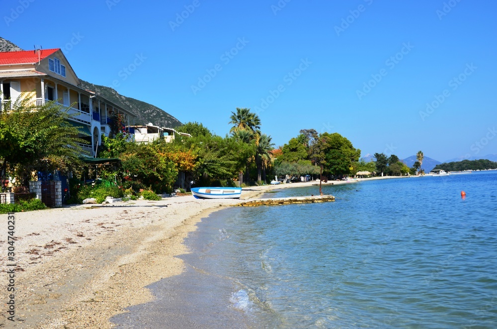 Obraz premium Nydri, Lefkada Island, Greece. 10/22/2019. buildings on the coast. beachfront apartments, beach without people
