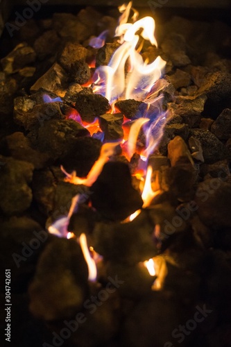 Sirsa, India - 7 July 2019: Fire coming out beautifully from stones at night in a small village in Haryana. photo