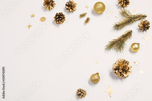golden Christmas decorations on white background