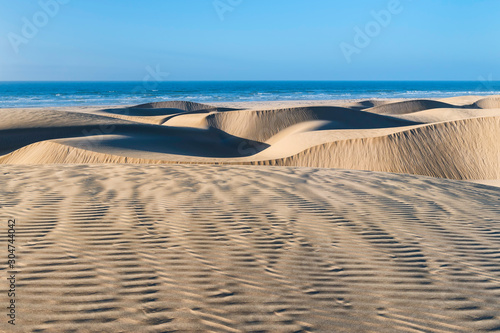 Fototapeta Naklejka Na Ścianę i Meble -  Desert sand dunes at the Lagoon of Khenifiss (Lac Naila).
