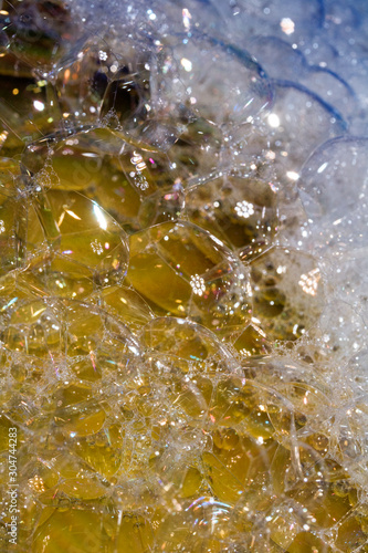 Close Up of Bath Water Bubbles Foam For Background In Yellow