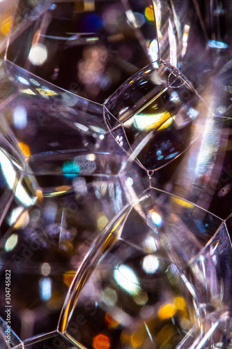 Close Up of Bath Water Bubbles Foam For Background In Black Rainbows