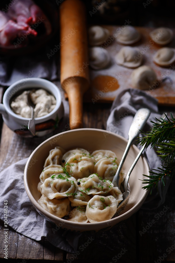 Pelmeni on wooden board.style rustic. Pelmeni on wooden board.style rustic.