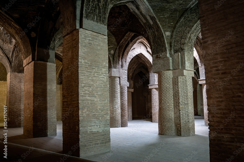 Ancient columns of hypostyle hall inside the Jameh Mosque of Isfahan.