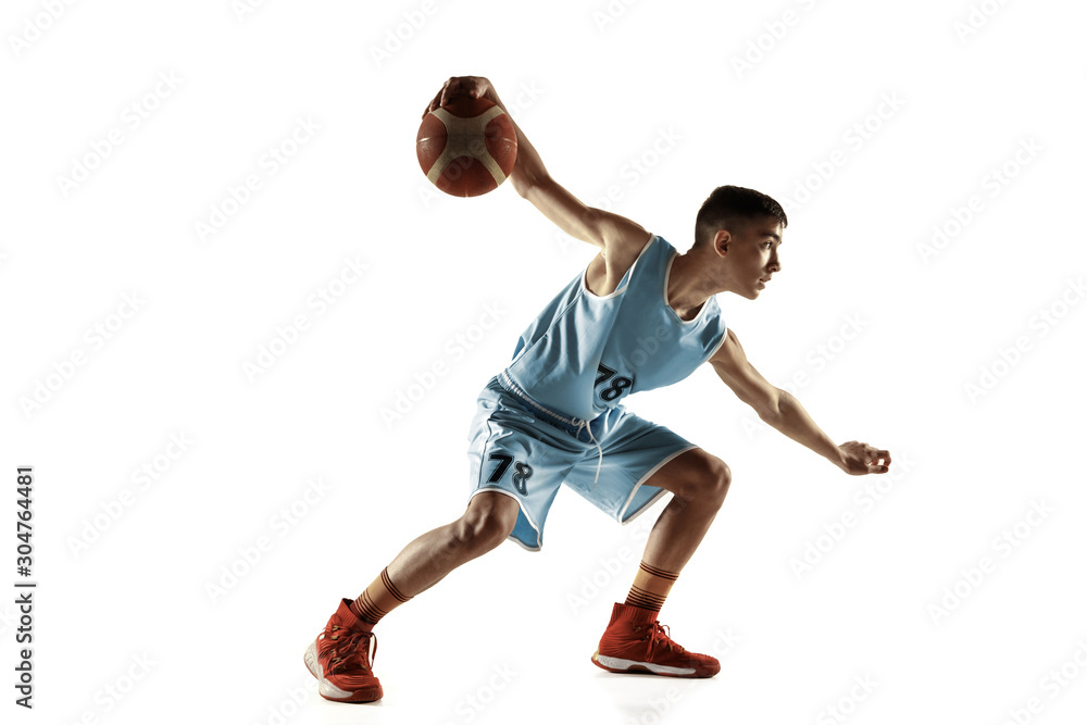 Full length portrait of young basketball player with a ball isolated on white studio background. Teenager training and practicing in action, motion. Concept of sport, movement, healthy lifestyle, ad.