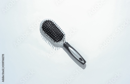 Stylish hairbrush on a white background. Women's Hair Care Accessories