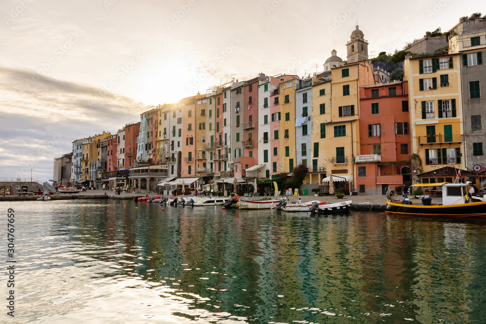 Harbor of Portovenere at sunset, quiet harbor moored boats, end of tourist season
