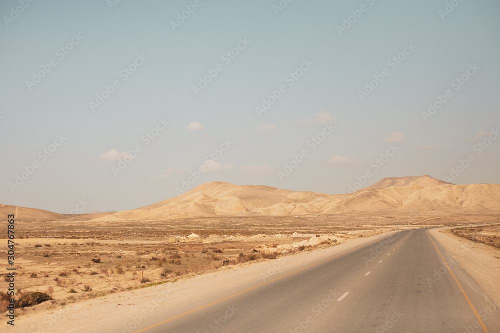 A beautiful photograph of a road in an open area. A beautiful photograph of a road in an open area.