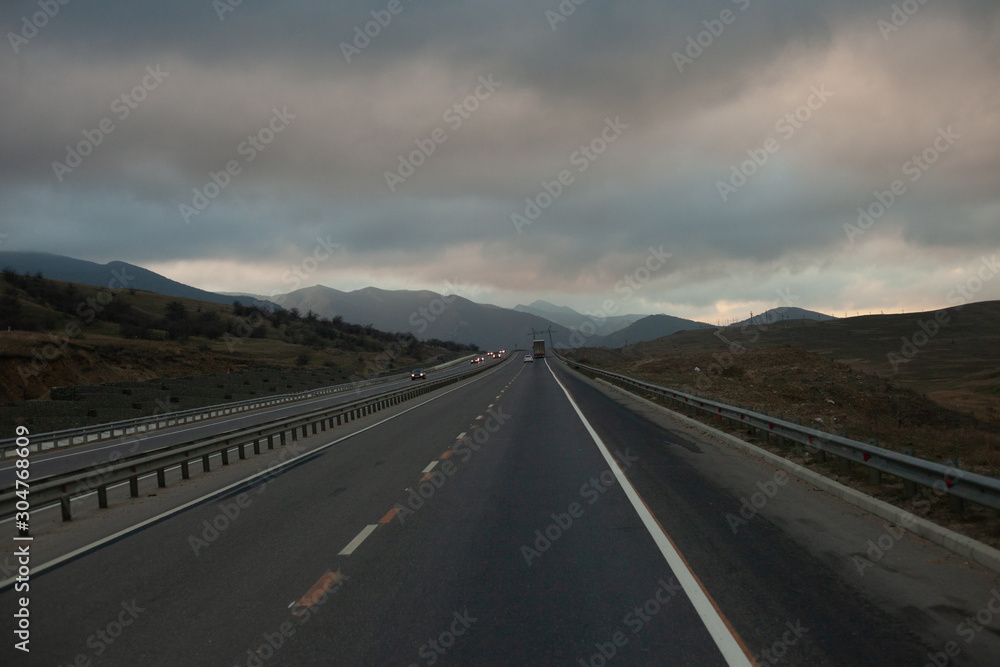 Heavy dense fog in the mountains near the road.