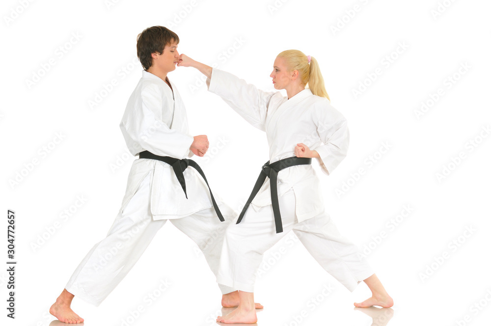 Cute blonde girl and a young cheeky guy karate