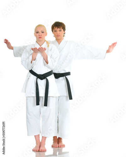 Young talented time karate athletes in a kimono
