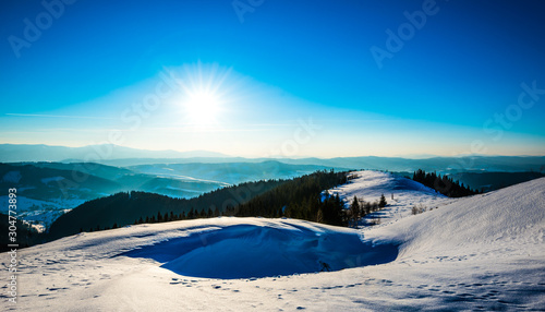 Bright picturesque sunny panorama of ski slopes © YouraPechkin