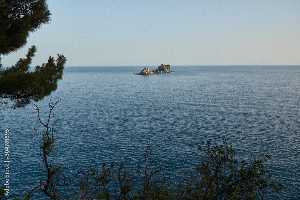 Small stone island in the sea near Sidari, Corfu, Greece