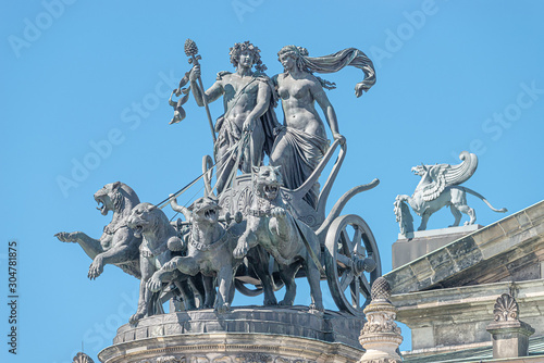 Old statue of Dionis and Aridna quadriga with four panthers on the top of the State Opera House in downtown of Dresden, Germany, details, closeup photo