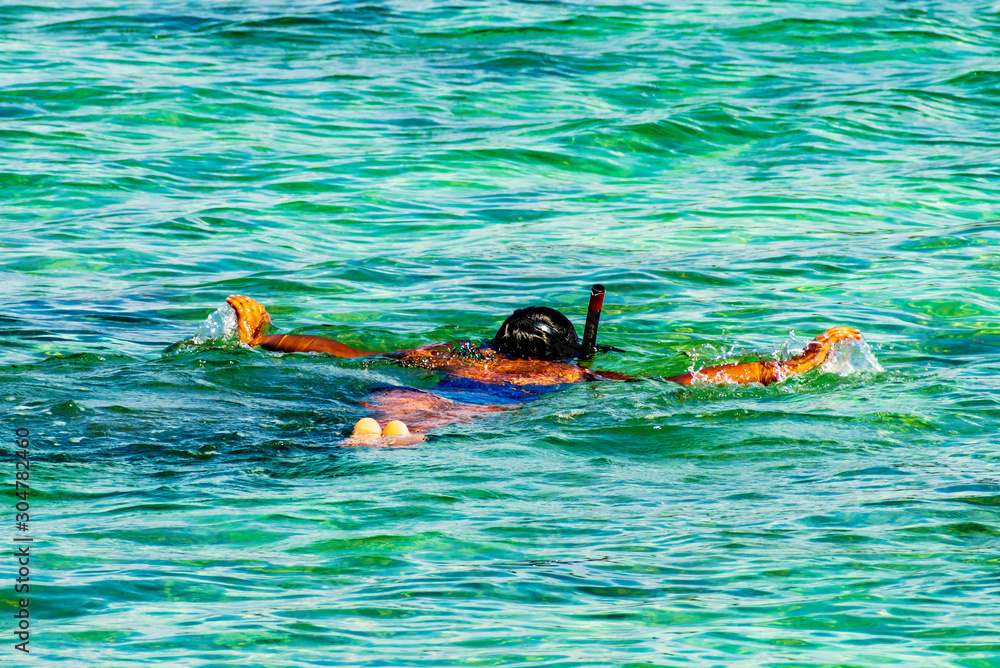 Besar, Perhentian Island, Malaysia; 18-May-2019; a lady snorkeling in the sea, Perhentian Islands, Malaysia