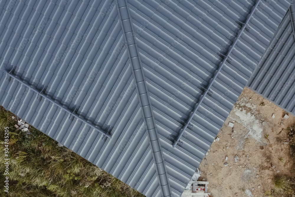 Obraz premium Corrugated metal roof and metal roofing. Modern roof made of met