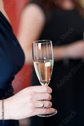 glass of wine in the guest's hand