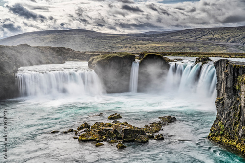 Godafoss waterfall, foggy from waterspray on a cloudy morning, Iceland © Uwe