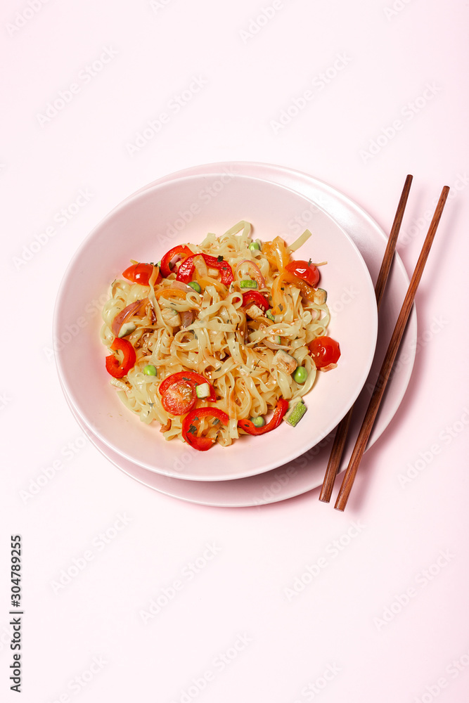Vegan noodles with peas, peppers, onion and zucchini