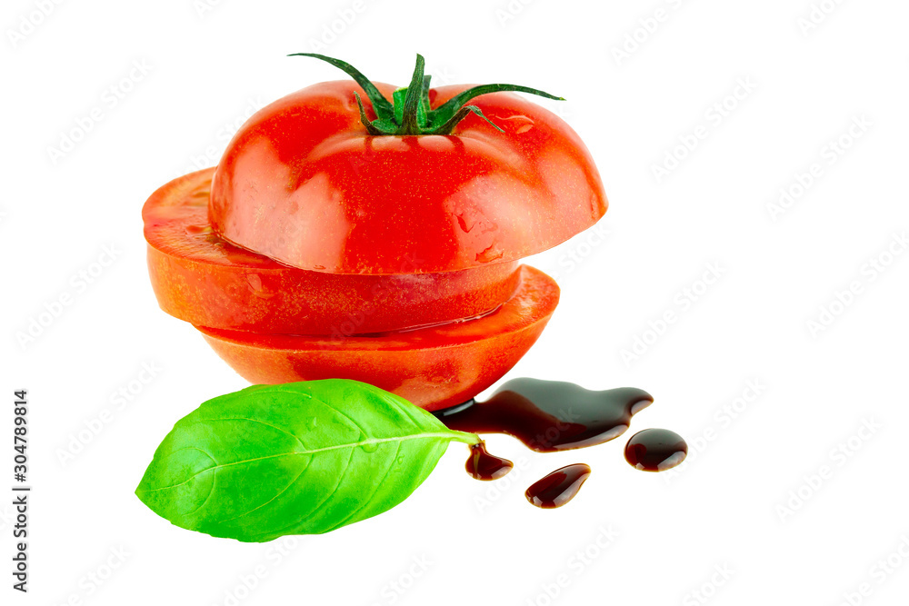 Tomato with basil leaf and balsamic vinegar isolated on white. Italian food cuisine concept Tomato with basil leaf and balsamic vinegar isolated on white. Italian food cuisine concept