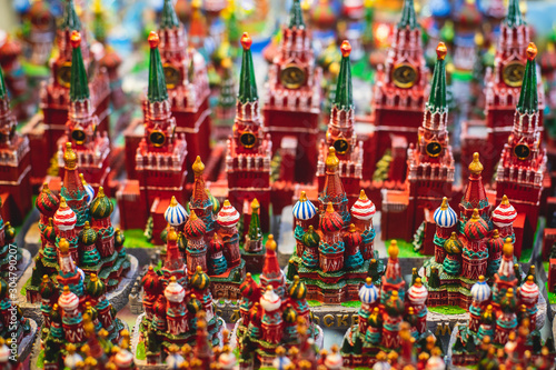 View of traditional souvenirs from Moscow, Russia, with fridge magnets with "Moscow" text, Kremlin and St. Basil Cathedral figure at local vendor souvenir shop on Red Square © tsuguliev