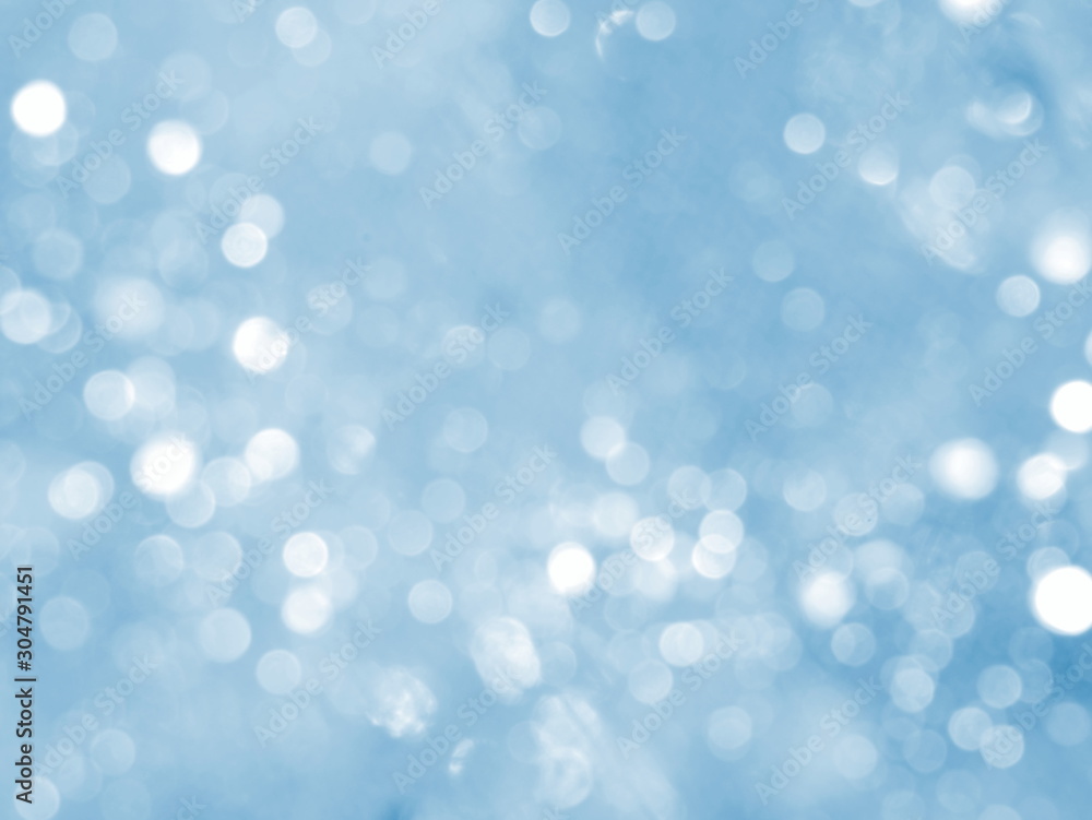 Blue background with abstract bokeh. Winter lights. Blue background with abstract bokeh. Winter lights.