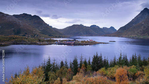 evening autumn landscape on the Lofoten islands in Norway. A small town between the sea and mountains