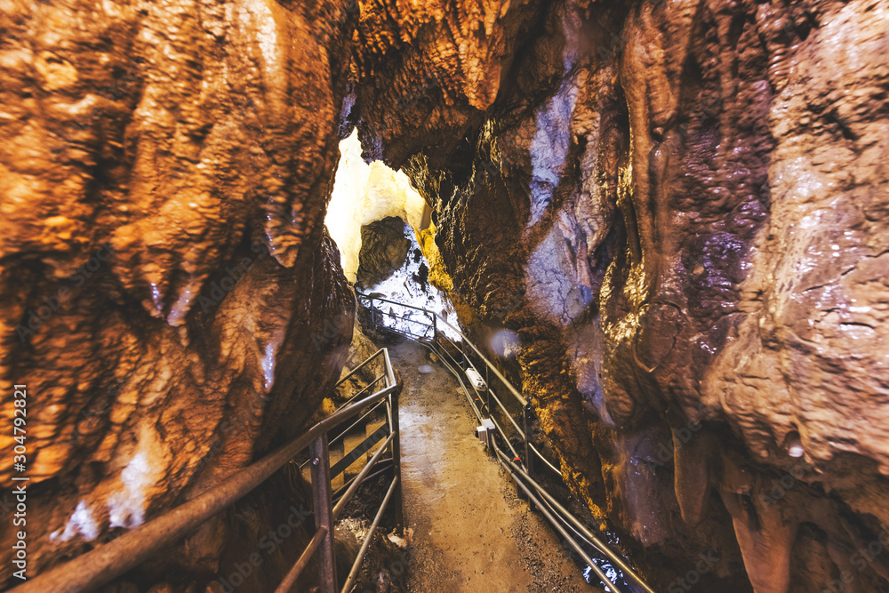 Fototapeta premium Inside limestone caves for speleological sightseeing