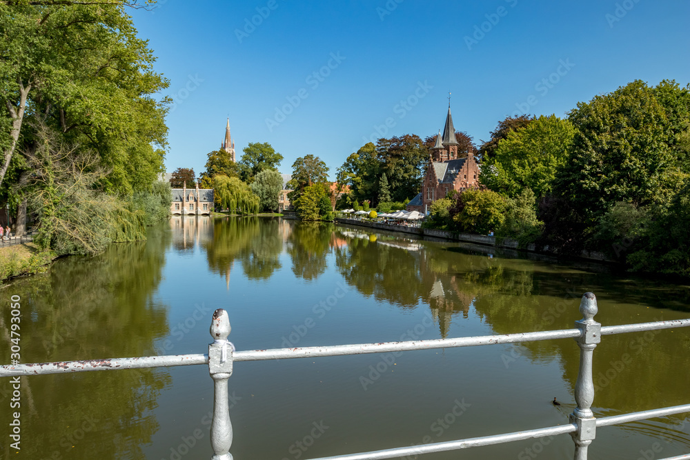 Calm scene of warm summer day. Street view of beautiful historic city center architecture of Bruges or Brugge, West Flanders province, Belgium. Lovely summer August weather
