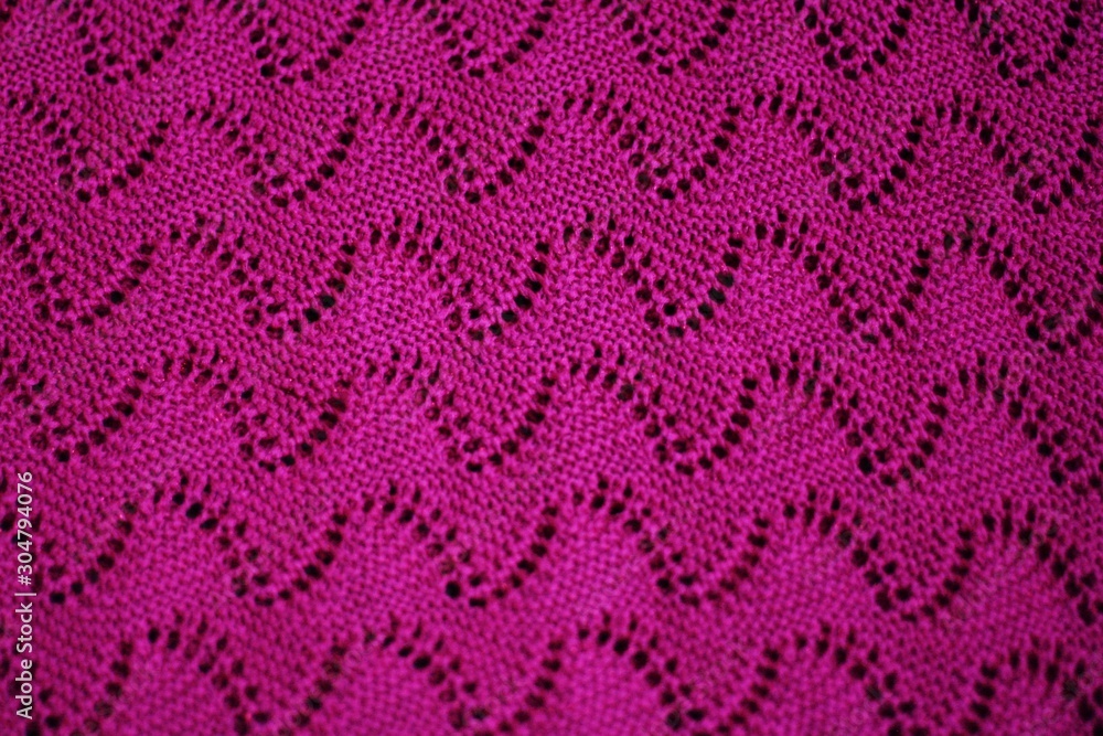 Beautiful knitted pink sweater close up view Beautiful knitted pink sweater close up view