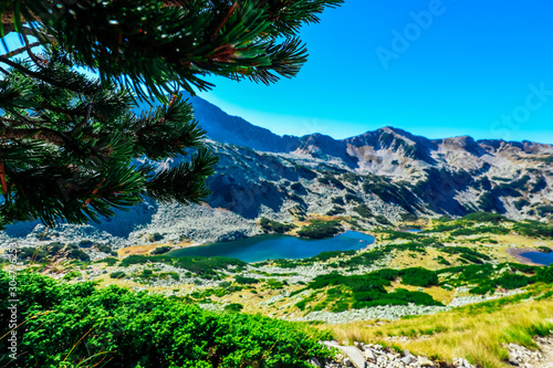 High mountain lake. Alpine nature, summer landscape backdrop. photo