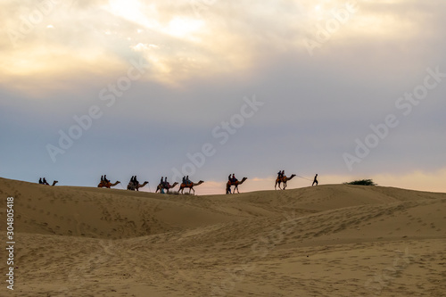 Sam Sand Dunes, Jaisalmer, Rajasthan, India; 24-Feb-2019; camel caravan ride in Thar desert, Jaisalmer, Rajasthan, India